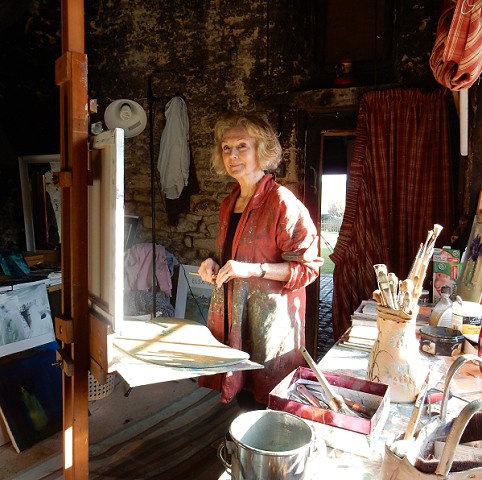 Elsa Taylor painting in her Cotswold studio